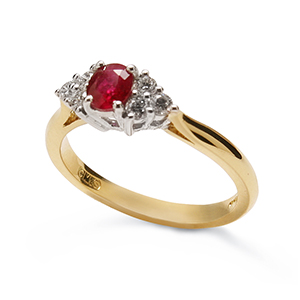 Oval ruby and brilliant cut diamond seven stone