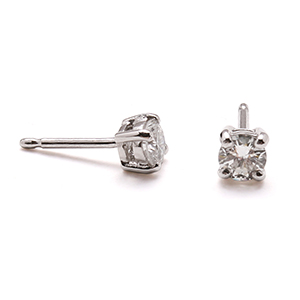 Four claw diamond studs in platinum